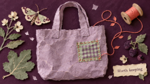 Torn-paper collage of a lilac tote with a checked patch, a moth, leaves and a note reading Worth keeping.